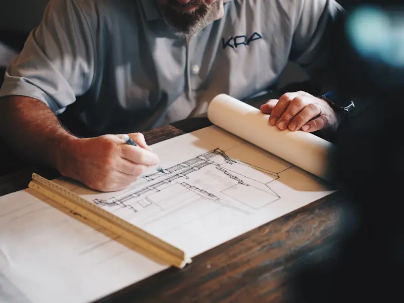 Construction worker using technology on job site
